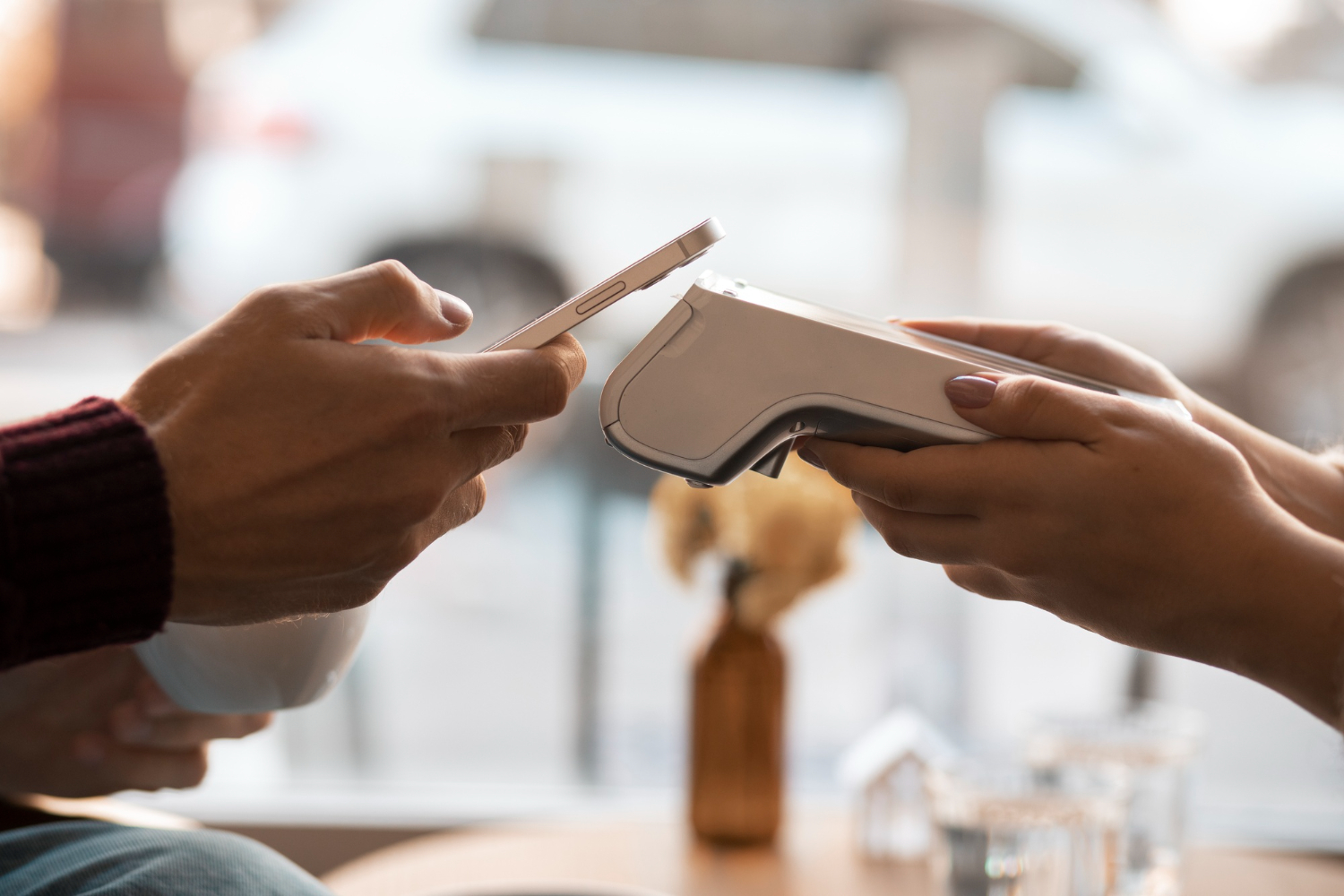 man makes payment using nfs on phone